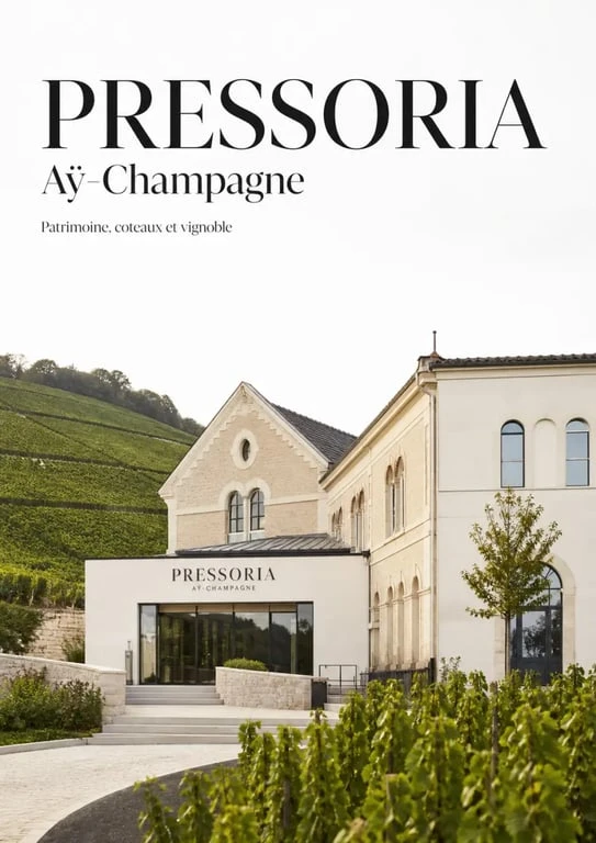 Pressoria voyage sensoriel au coeur du champagne à Aÿ-Champagne, vue du bâtiment patrimonial et des vignes